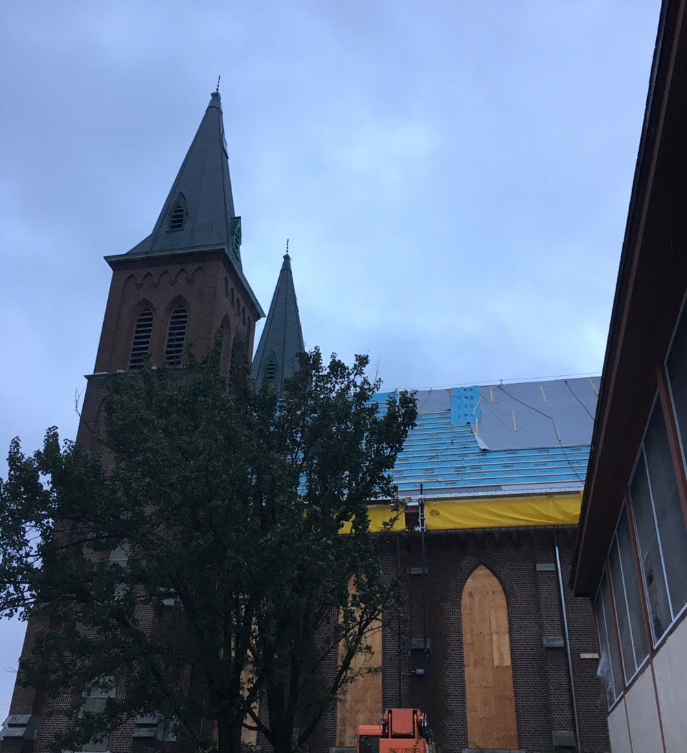 Standing seam metal roof going on at 501 Park Street church, Syracuse