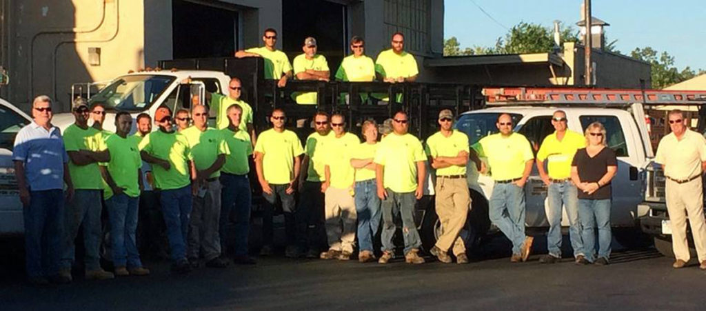 The Shaffer Building Services team in front of their trucks
